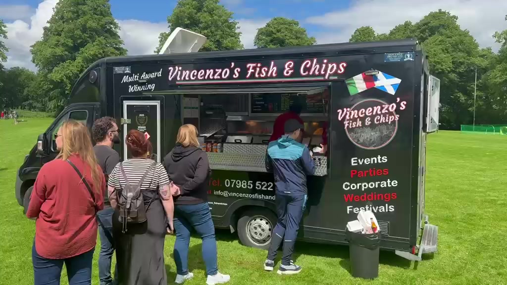 Customers queuing at Vincenzo's Fish & Chips Van